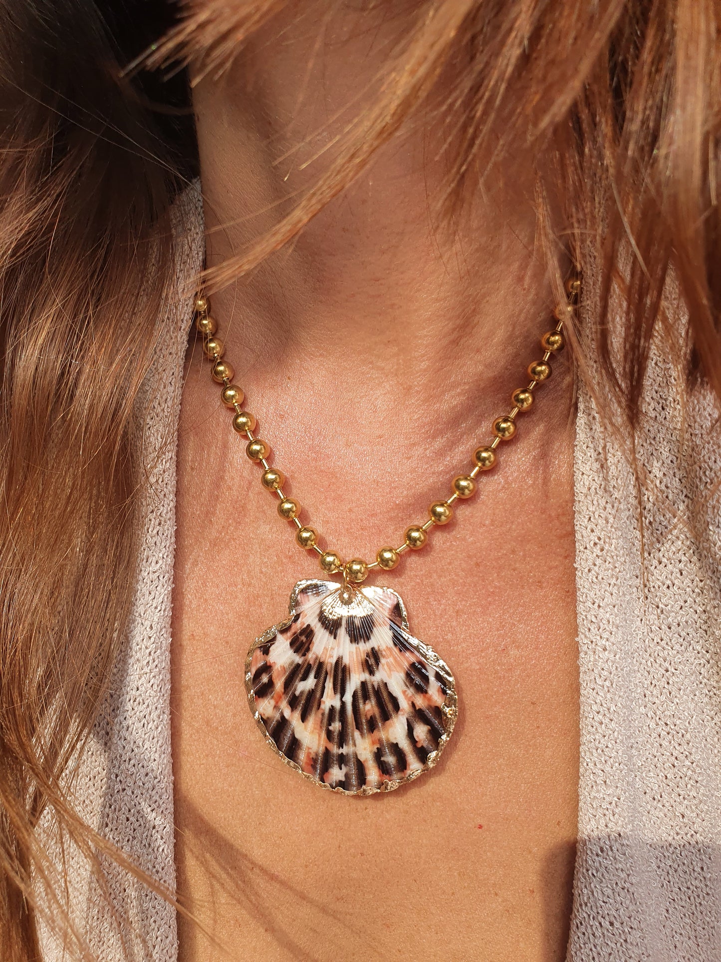 Collier coquillage léopard - doré