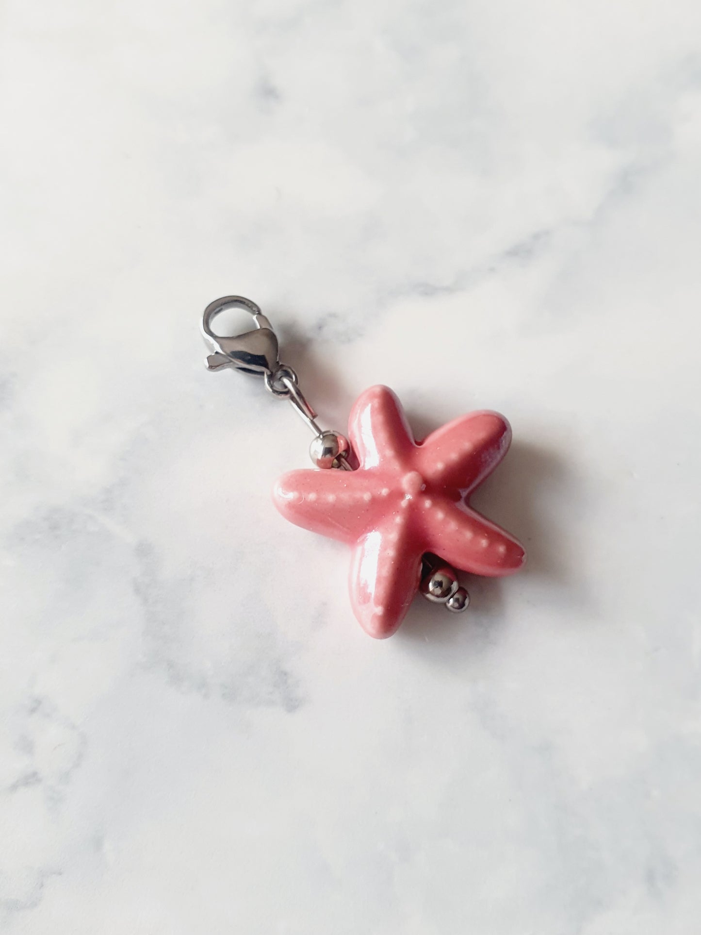 Charm étoile de mer - argenté | bois de rose