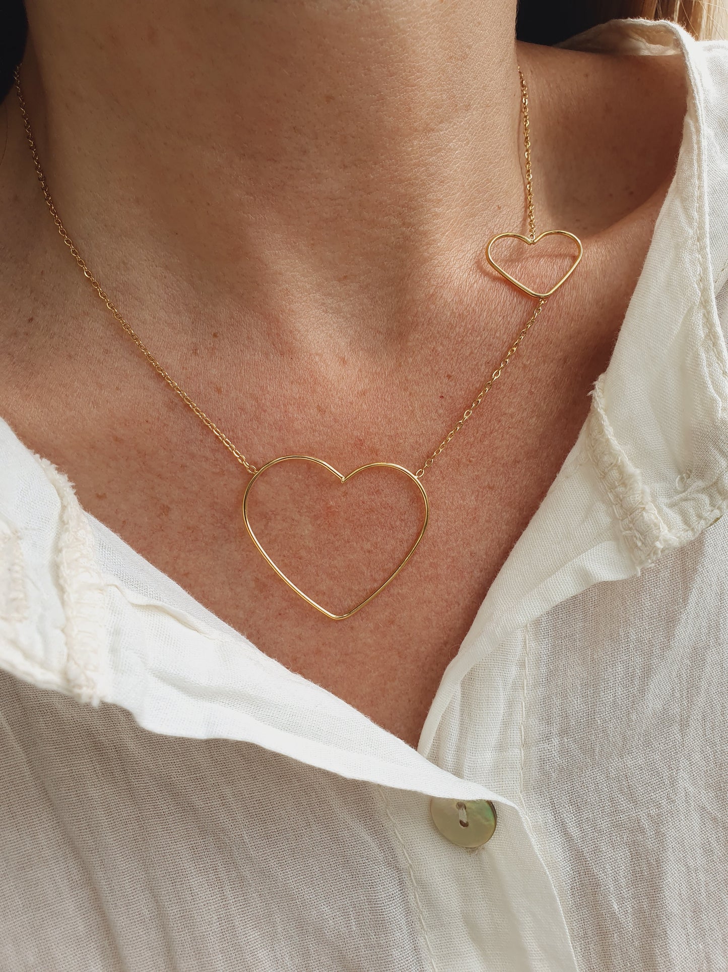 Collier duo de cœurs - doré