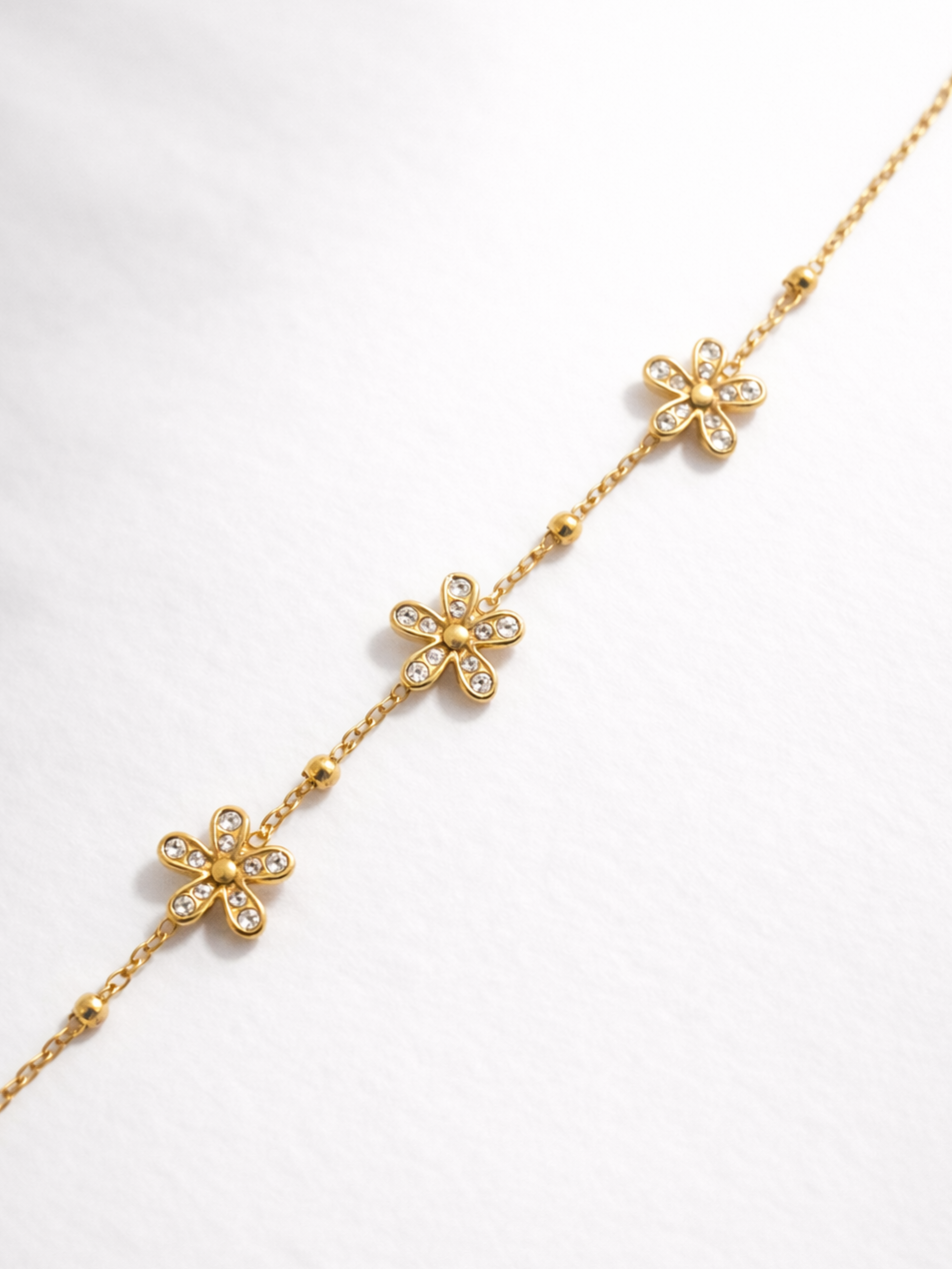 Bracelet fleurs zircons - doré