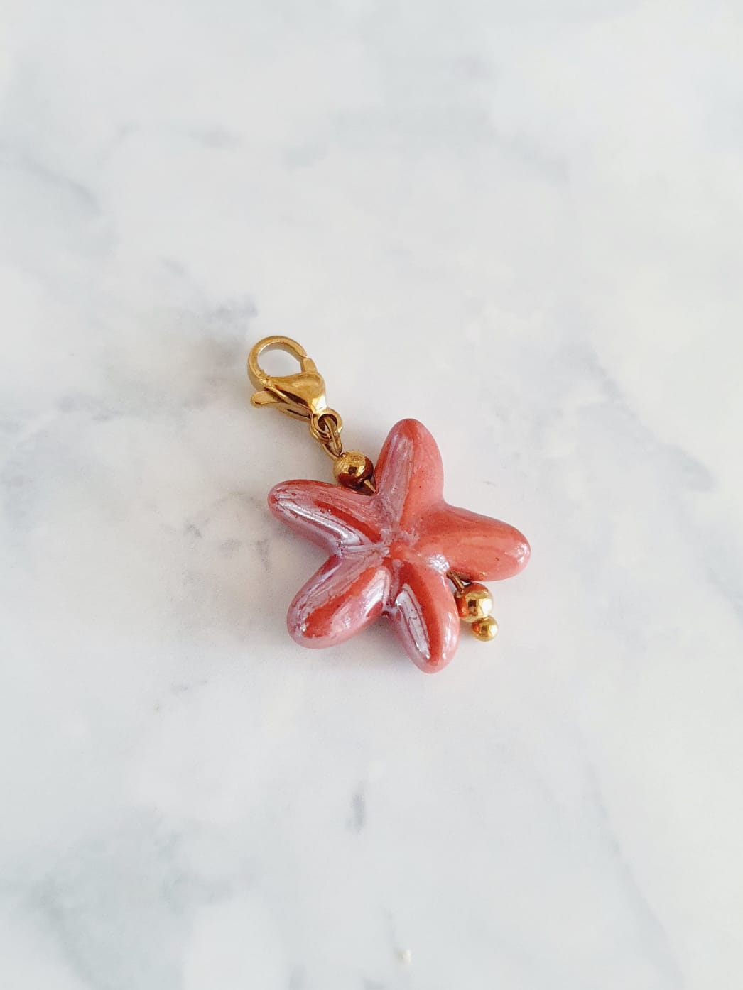 Charm étoile de mer - doré / rose terracotta
