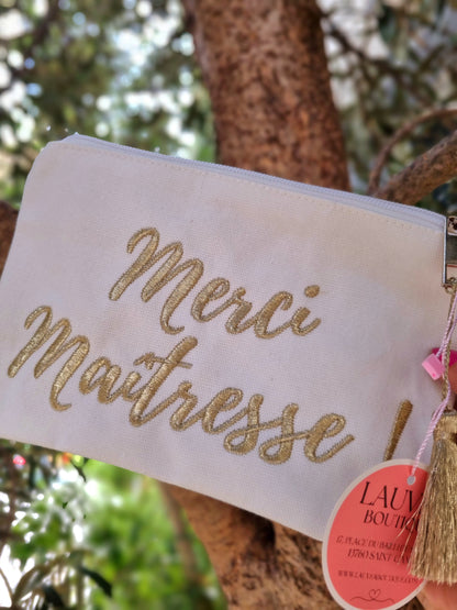 Pochette broderies dorées avec pompon "Merci Maîtresse"