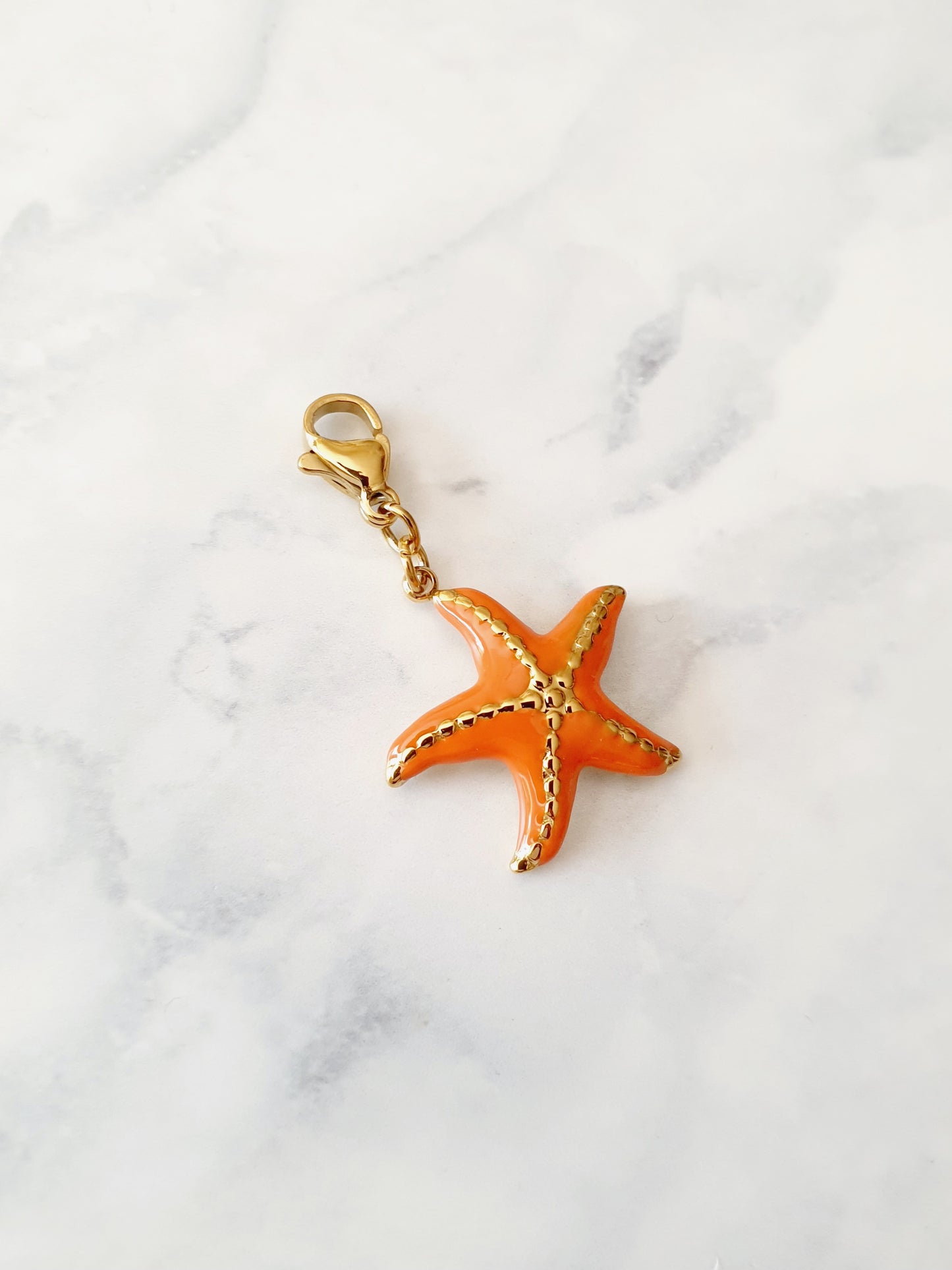 Charm étoile de mer texturée orange - doré