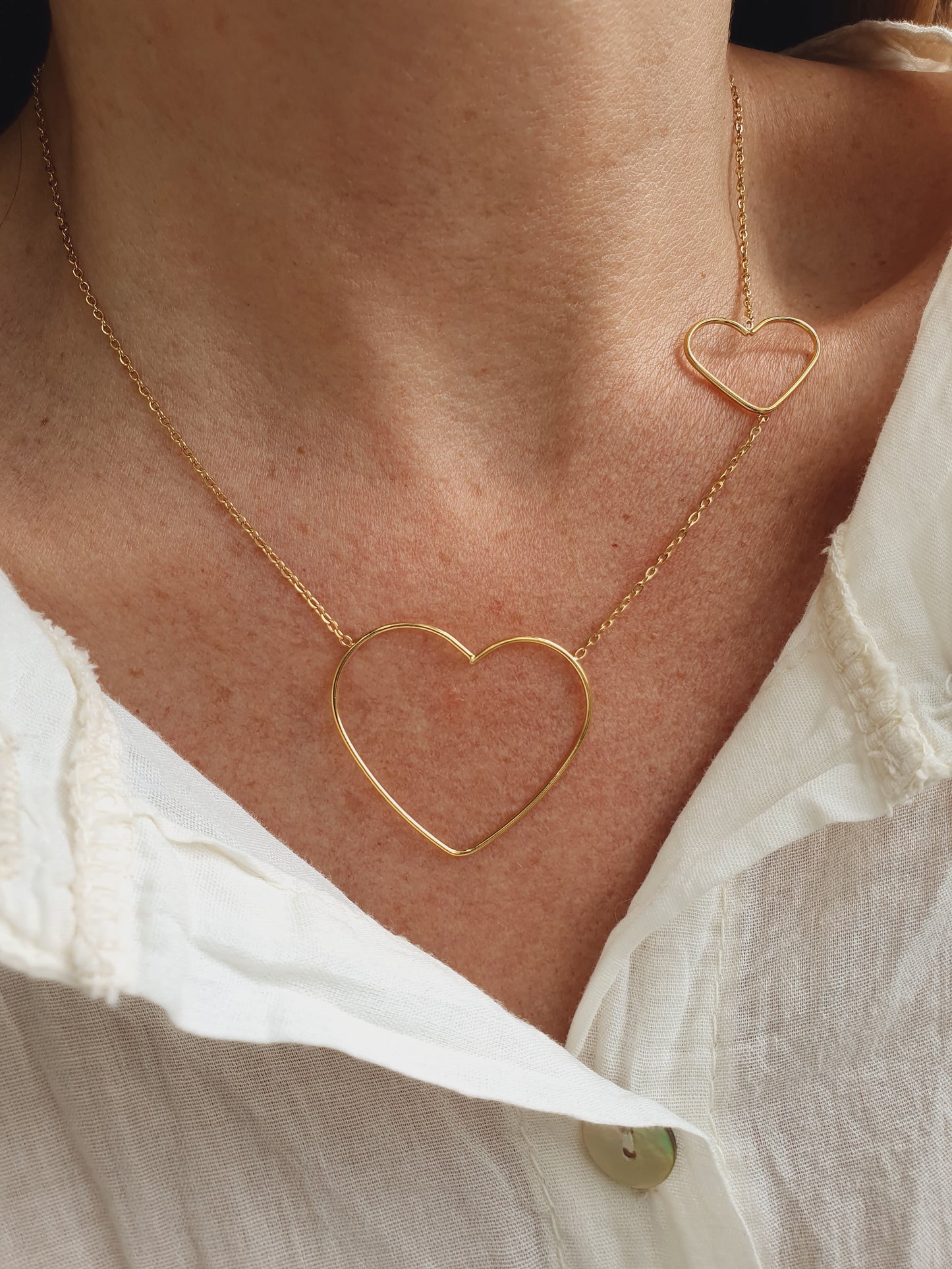 Collier duo de cœurs - doré
