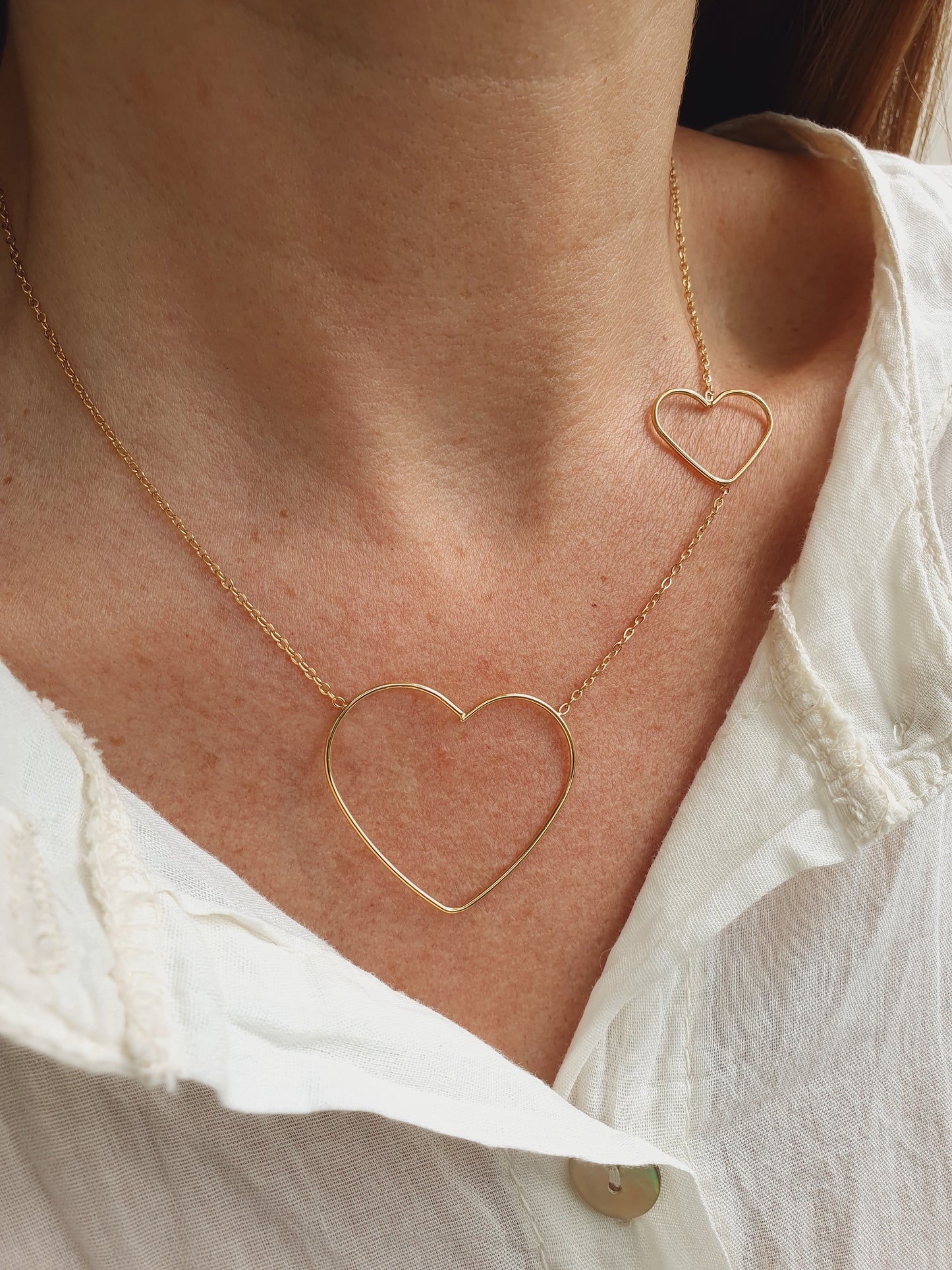 Collier duo de cœurs - doré
