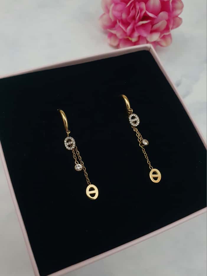 Boucles d'oreilles pendantes maille marine et zircons - doré