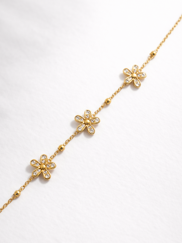 Bracelet fleurs zircons - doré