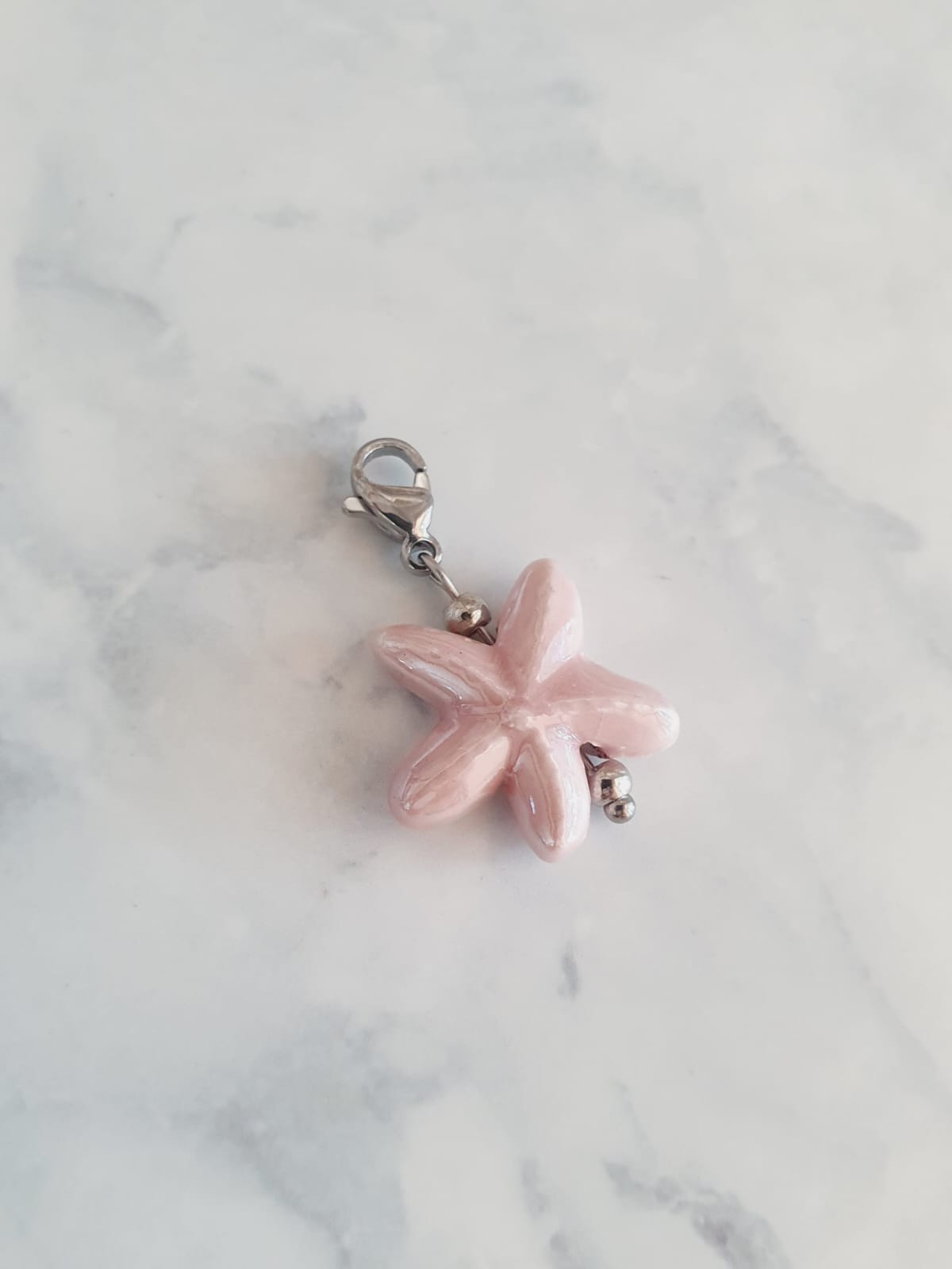 Charm étoile de mer - argenté / rose poudré