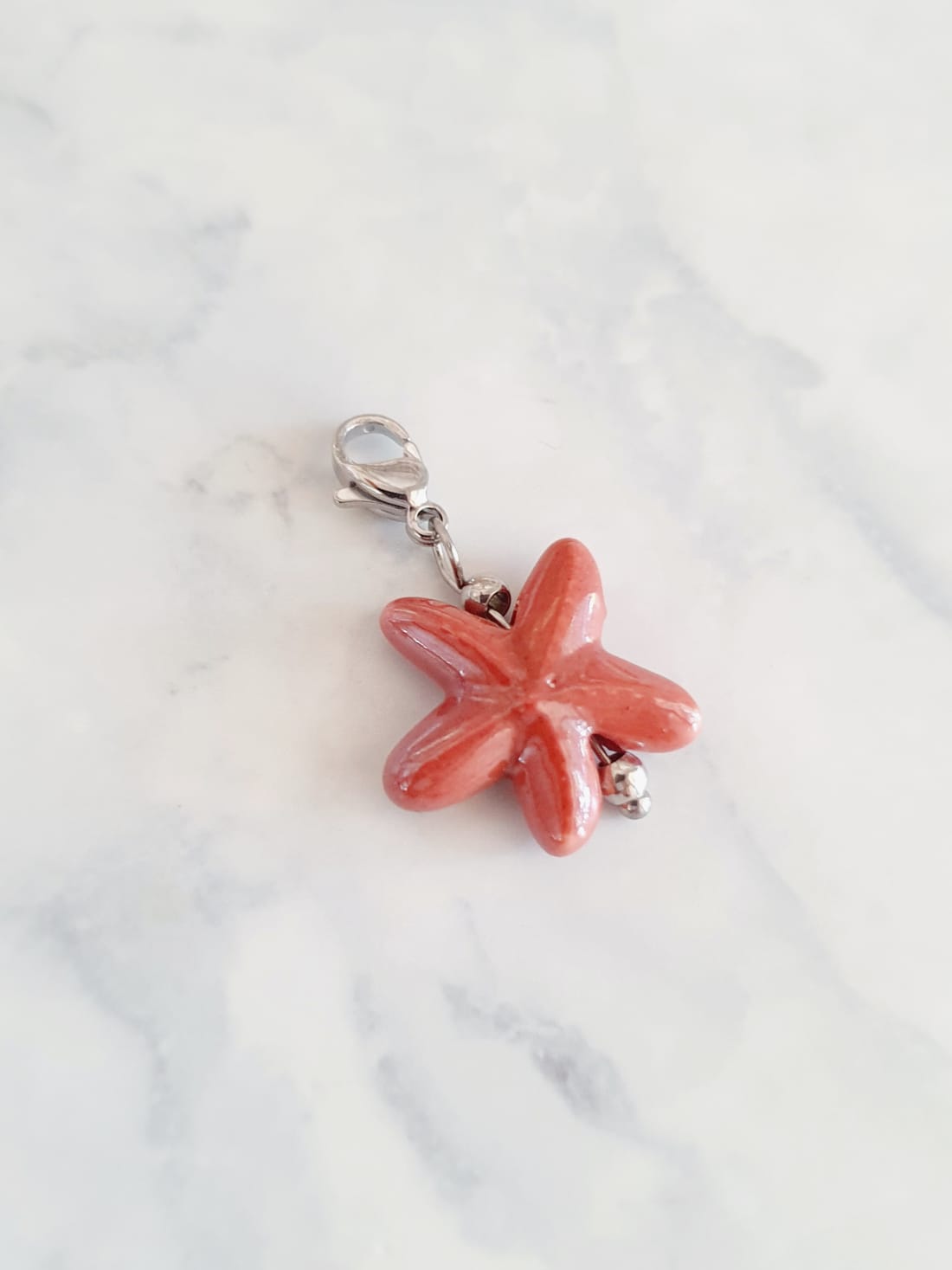 Charm étoile de mer - argenté / rose terracotta