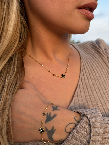 Collier trèfle zircons noir | doré