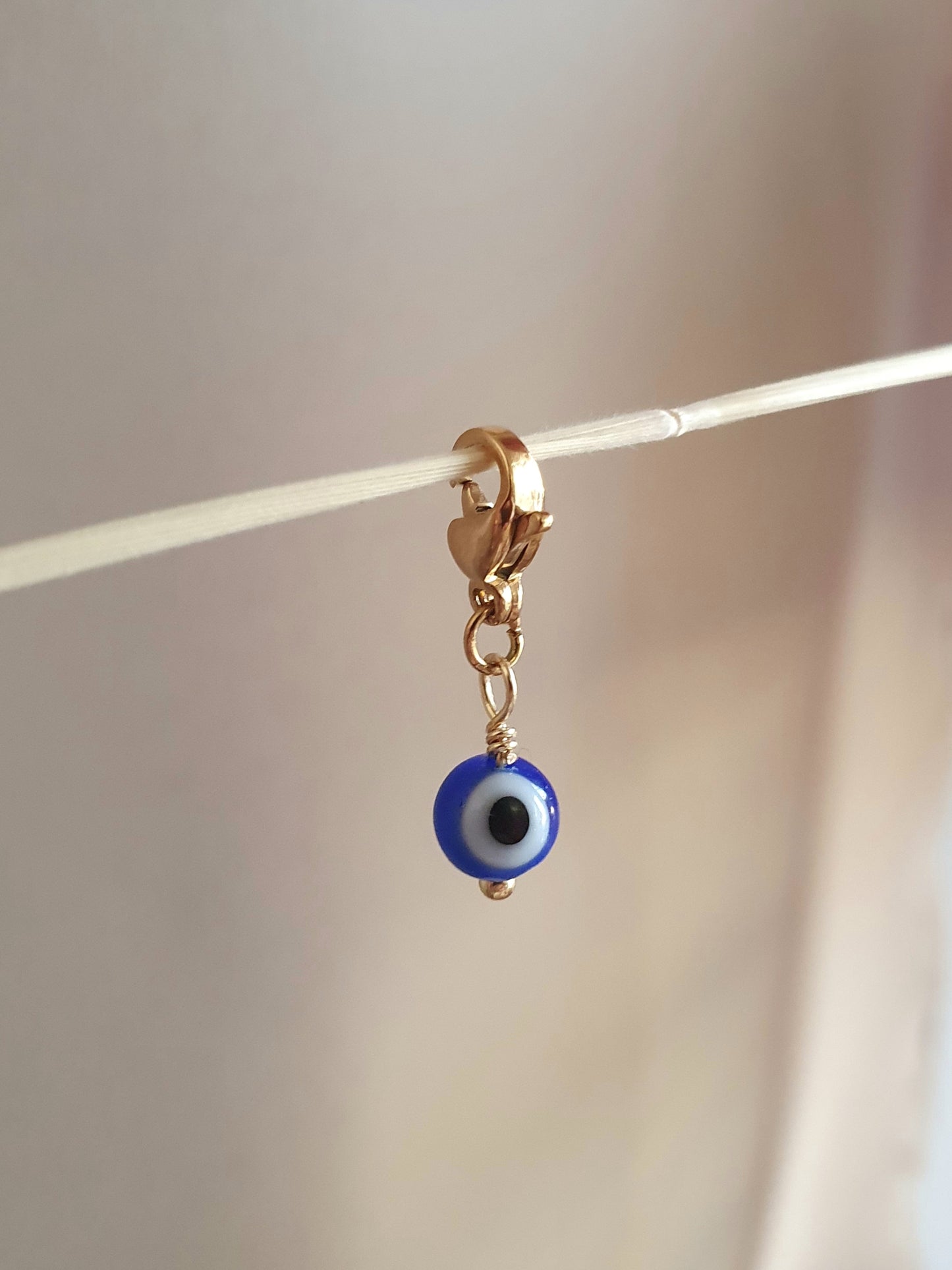 Charm œil turc en perle de verre - doré